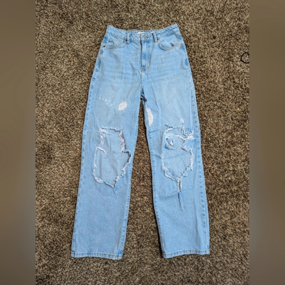 Woman's Straight Leg Ripped Jeans